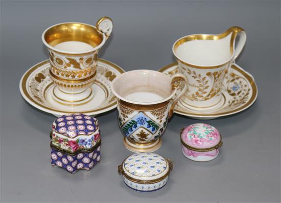 Two early 19th century Empire style coffee cups and a Berlin cup and saucer, and three porcelain trinket boxes